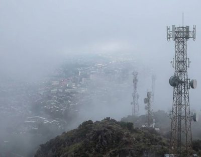 Microwave and cellular towers among fog